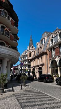 Quaint European street view showcasing historic architecture under a clear blue sky.