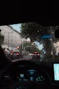 Rainy City Drive Through Car Windshield