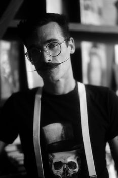 A stylish black and white portrait of a man with a mustache in Orlando, Florida.