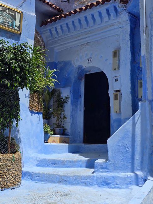 Striking blue facade in Chefchaouen's old town, showcasing traditional Moroccan architecture.