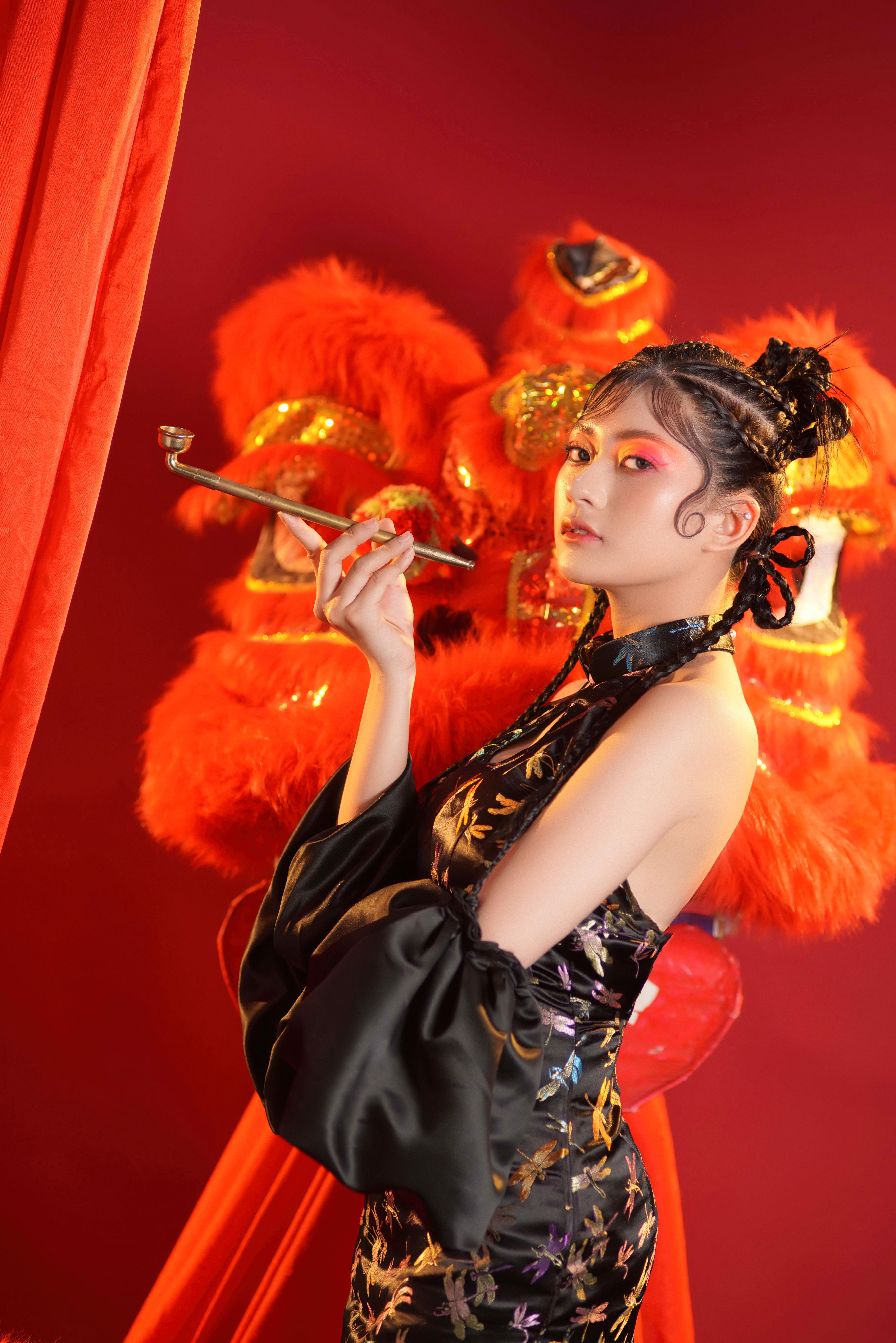 Elegant Woman in Traditional Chinese Dress  Free Stock Photo