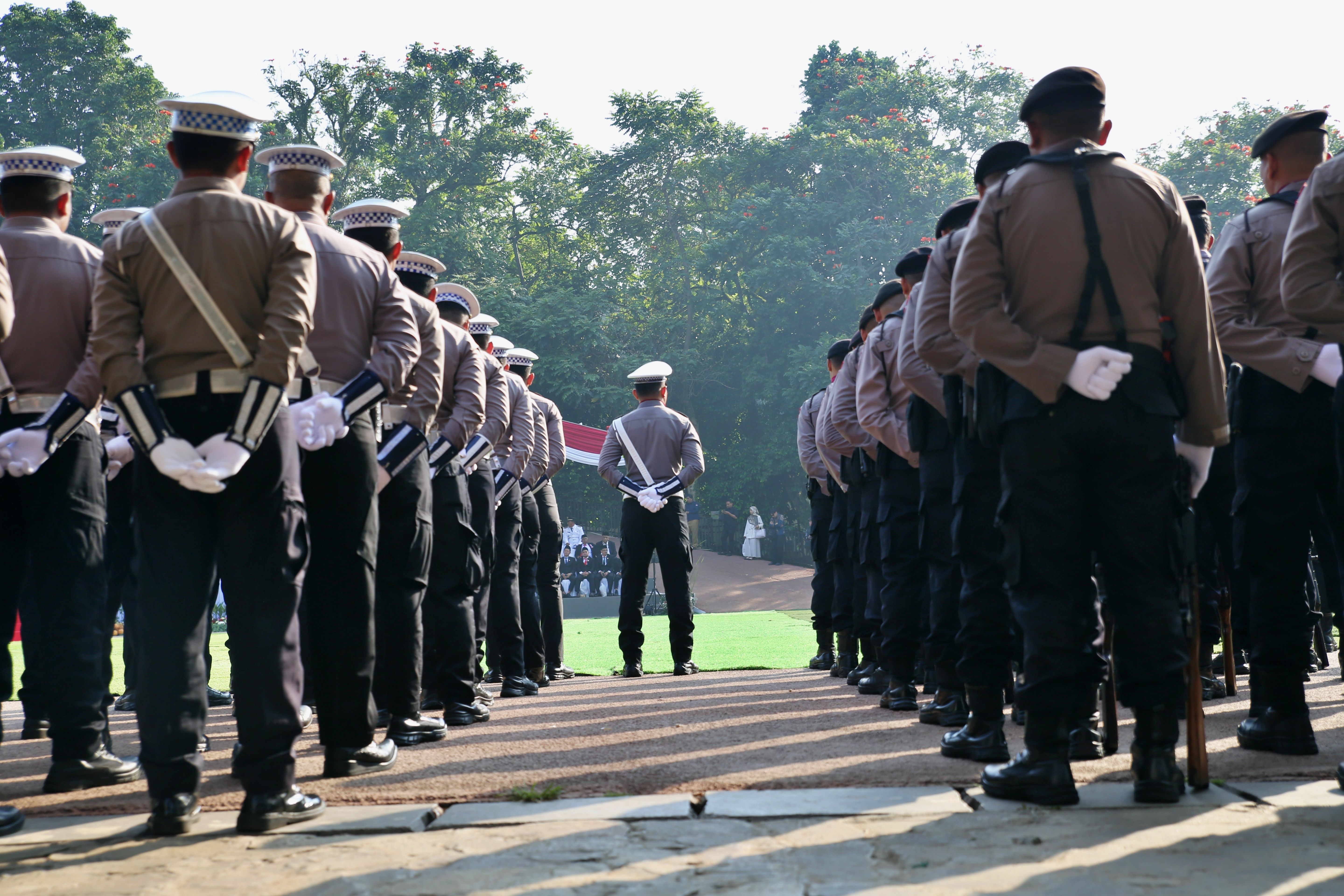 Police Officers Standing in Formation Outdoors · Free Stock Photo