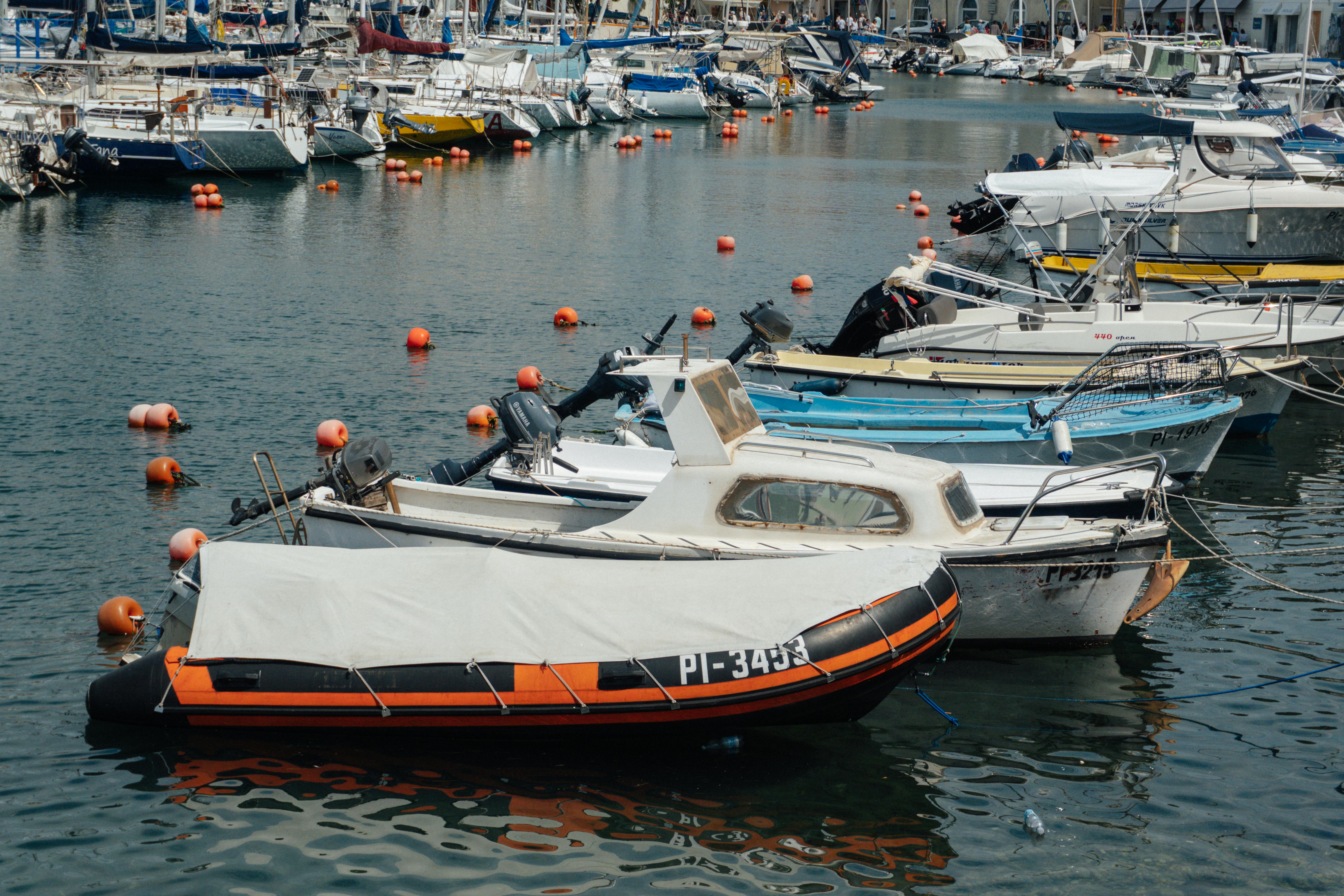 A vibrant scene of boats moored in the picturesque marina of Piran, Slovenia.