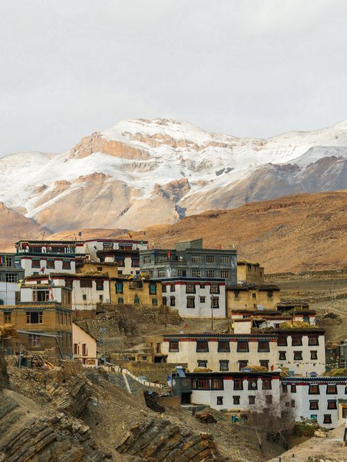 Free Monastery nestled in the Himalayas with stunning snow-capped mountains. Perfect for adventure and travel enthusiasts. Stock Photo