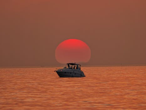 A serene boat ride at sunset on a Bavarian lake, capturing the tranquil beauty of nature.