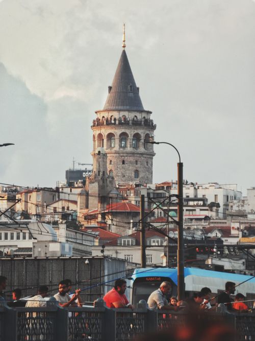 Free Captivating view of Galata Tower with busy streets in Istanbul, Turkey. A blend of ancient architecture and modern life. Stock Photo