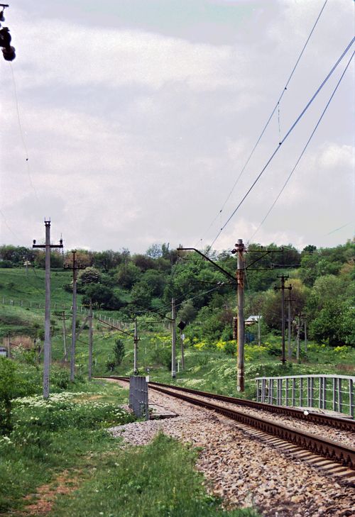 Free Scenic view of railway tracks through a lush green landscape in Dnipro, Ukraine. Stock Photo