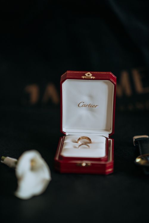 Free An elegant engagement ring displayed in a luxurious Cartier jewelry box, perfect for special occasions. Stock Photo