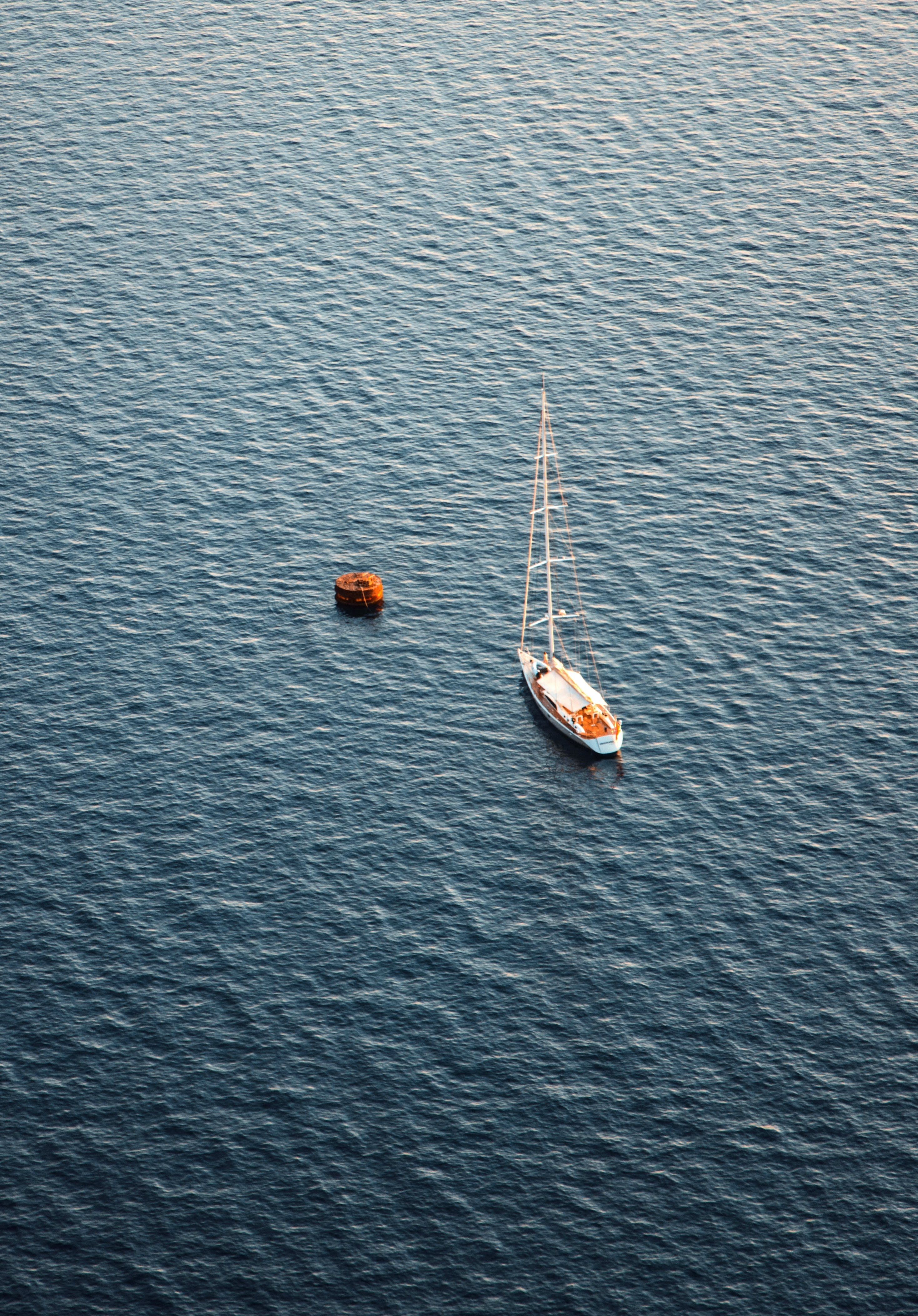 Aerial View of Sailboat on Tranquil Ocean Waters · Free Stock Photo