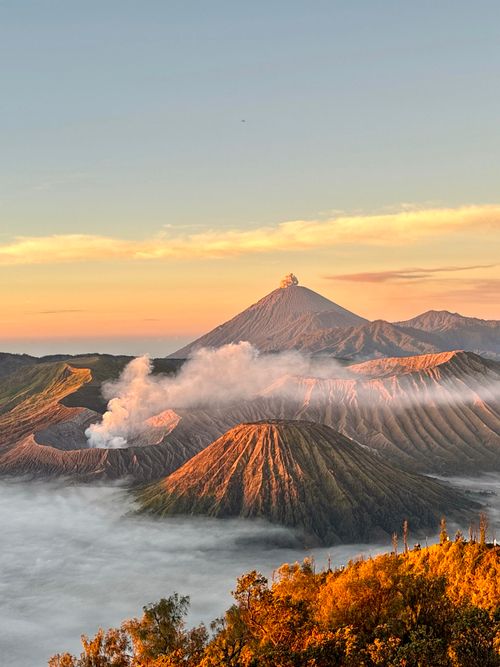 Free Stunning sunrise view of Mount Bromo with mist and volcanic landscape in Indonesia. Stock Photo