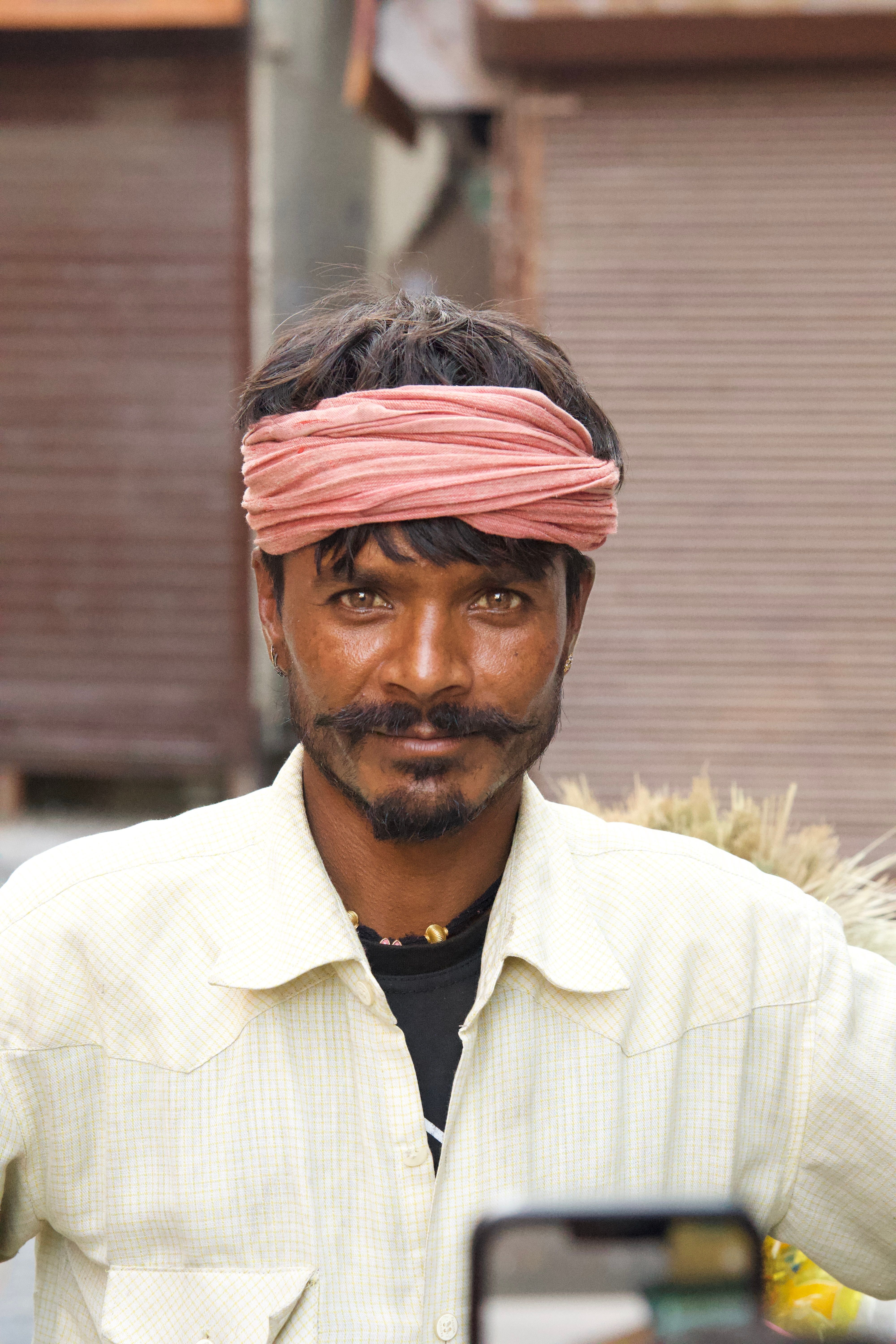 Portrait of Smiling Man with Traditional Headwear · Free Stock Photo