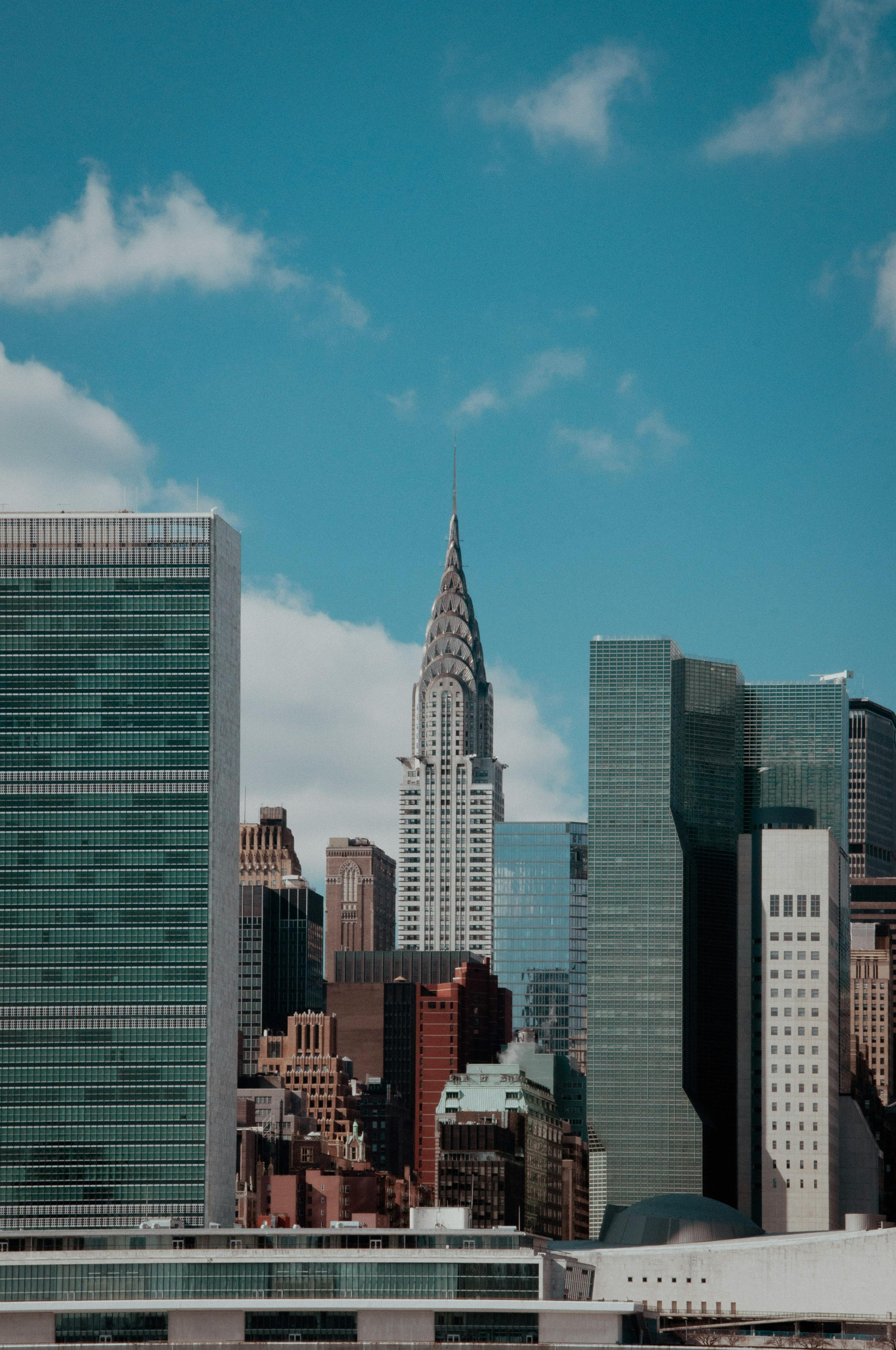 Stunning view of New York City's skyline with the Chrysler Building and modern architecture under a clear blue sky.