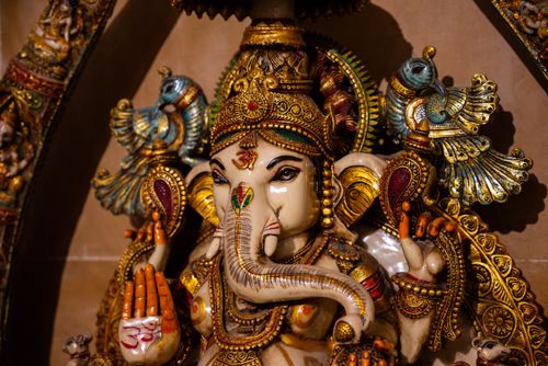 Free Detailed image of an ornate Ganesha idol showcasing intricate craftsmanship and cultural significance. Stock Photo