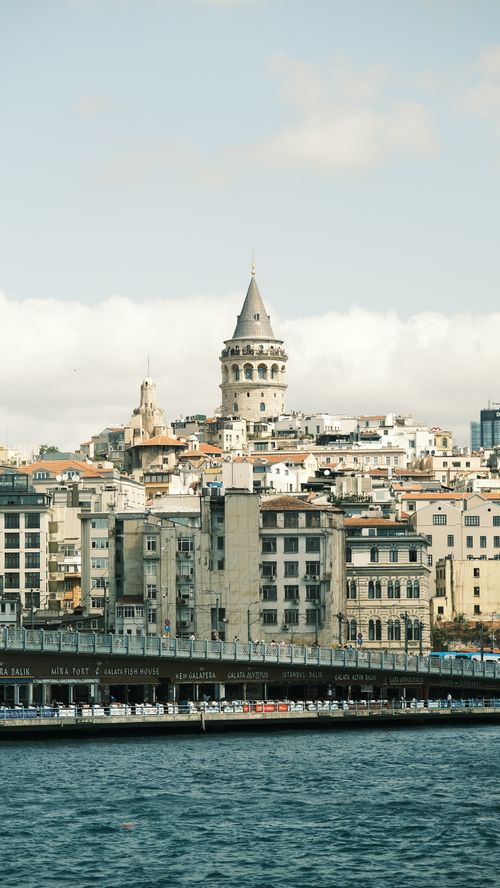 Free Scenic view of Galata Tower amidst historic Istanbul architecture by the waterfront. Stock Photo