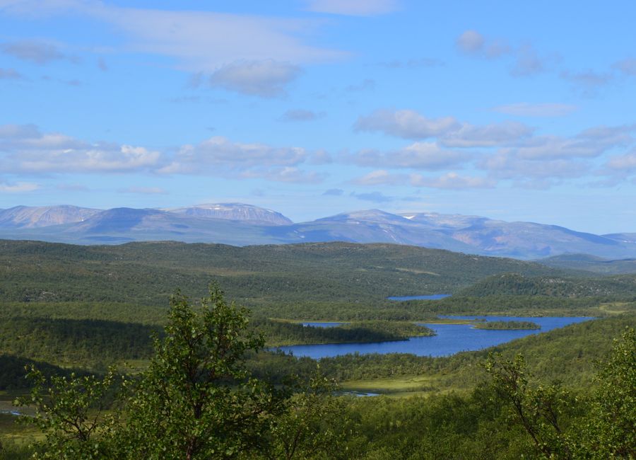 Majestic view of lakes and mountains in Porsangmoen, Finnmark, Norway on a sunny day.