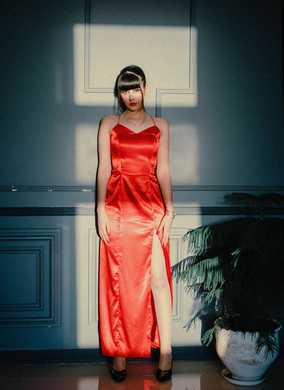 Elegant Woman in Red Dress by Indoor Wall · Free Stock Photo