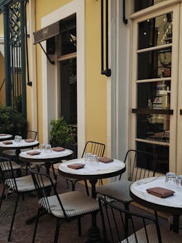 A quaint outdoor café with neatly set tables, perfect for a sunny day in Istanbul.
