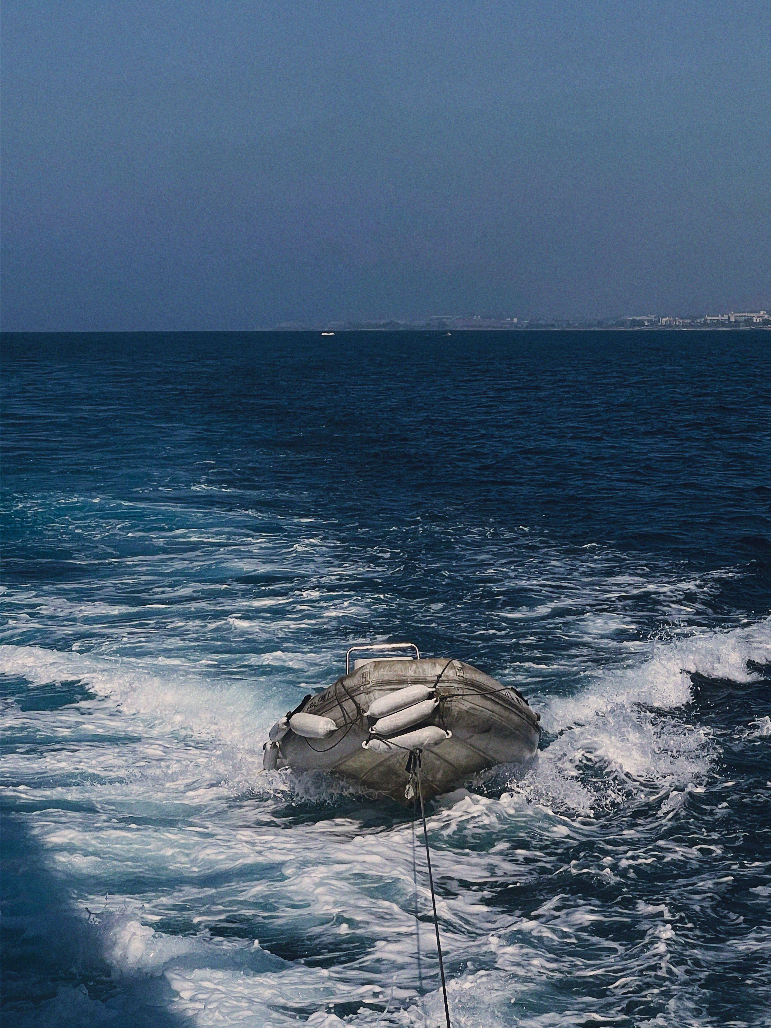Ocean Rescue Raft Floating in Blue Sea · Free Stock Photo
