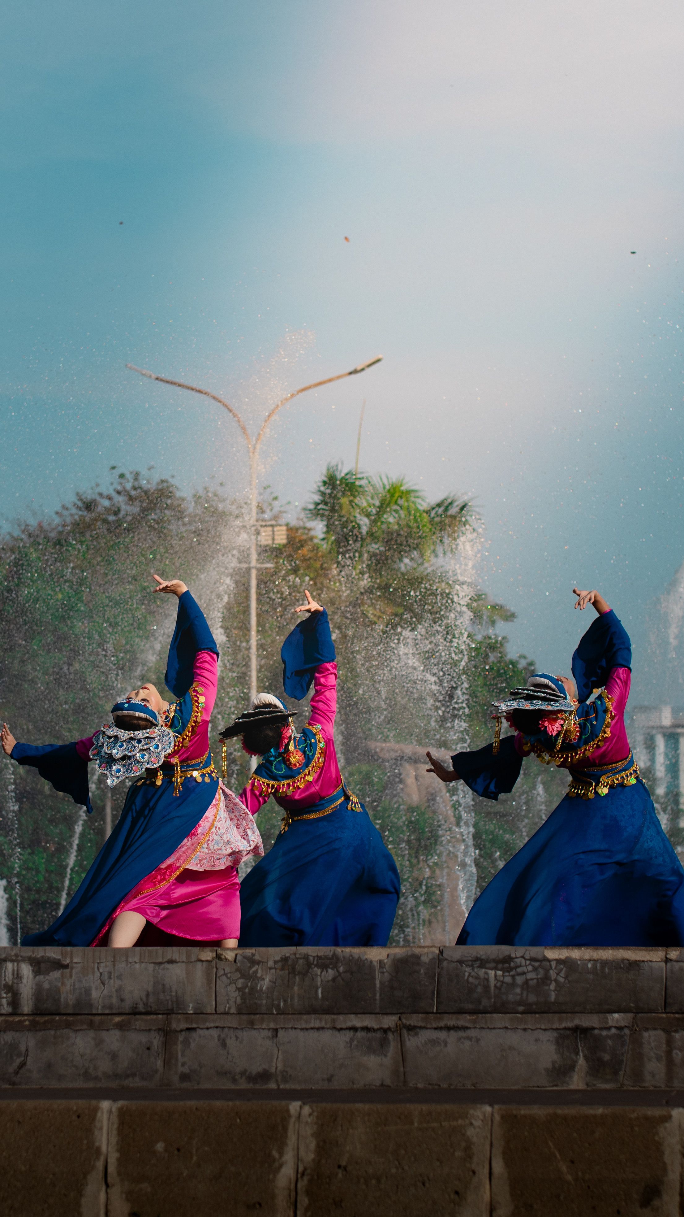 Colorful traditional Indonesian dancers performing outdoors in Jakarta, embodying rich cultural heritage.