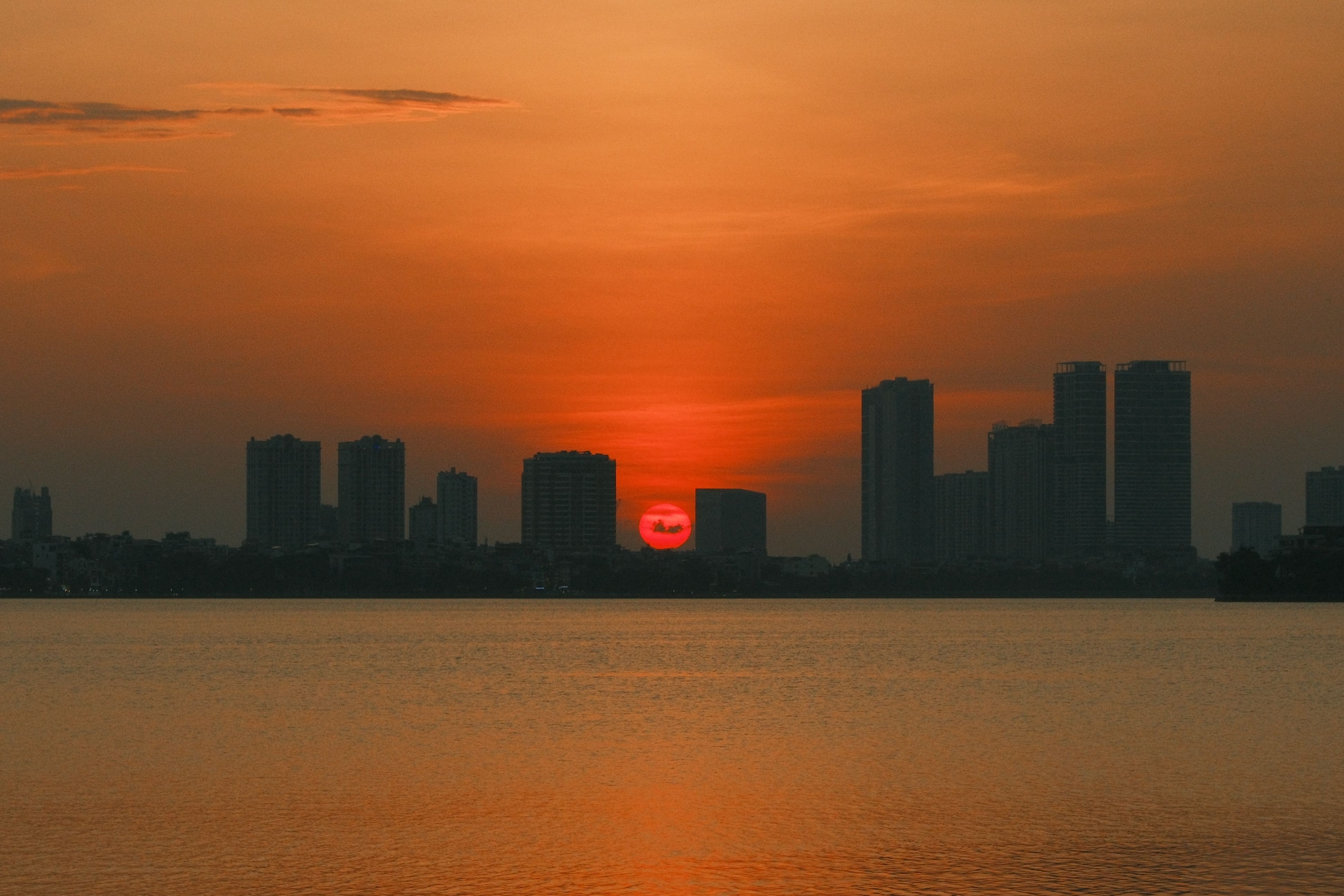 Stunning Hanoi Sunset Over Urban Skyline · Free Stock Photo