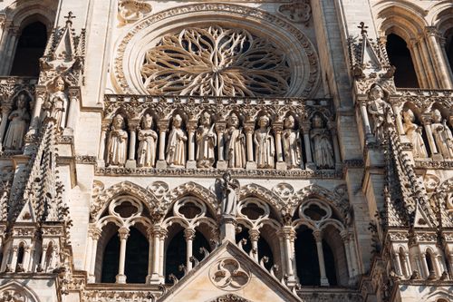 Free Detailed close-up of the Amiens Cathedral's Gothic architecture, showcasing ornate sculptures and rose window. Stock Photo