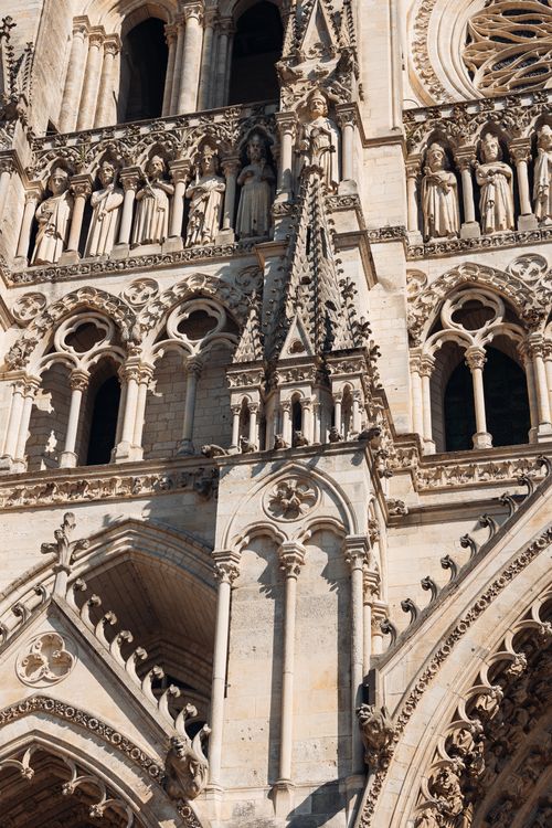 Free Close-up of Amiens Cathedral's intricate Gothic facade in bright daylight. Stock Photo