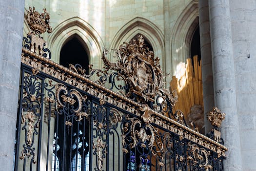 Ornate iron gate details inside the historic Amiens Cathedral, a Gothic architectural masterpiece in France.