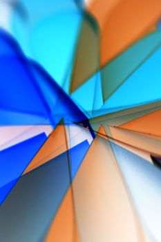 Vibrant abstract artwork with blue and orange geometric glass shapes creating dynamic patterns.