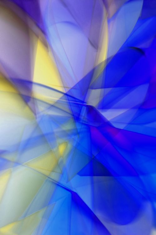 Free Dynamic abstract artwork featuring vibrant blue and yellow light patterns, creating a vivid and engaging visual. Stock Photo