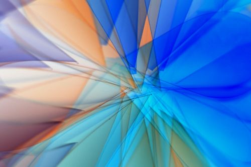 Free Vivid abstract artwork featuring blue and orange geometric patterns in dynamic motion. Stock Photo
