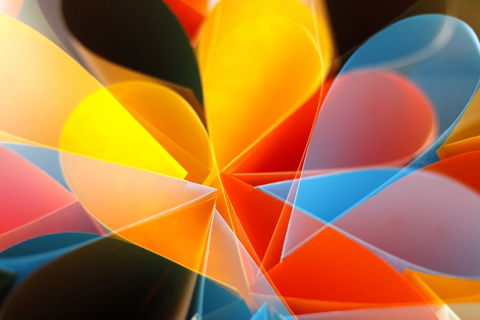 Colorful abstract art featuring overlapping geometric shapes in vivid hues.
