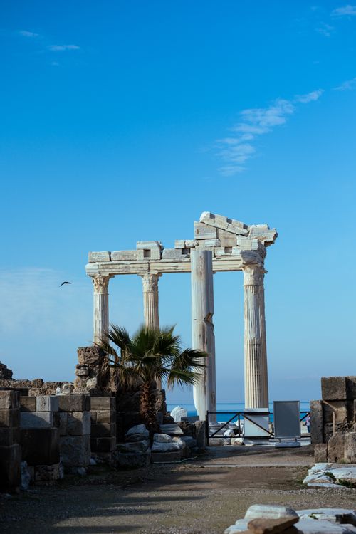 Free The Temple of Apollo's majestic ruins against a clear blue sky in Side, Türkiye. Stock Photo