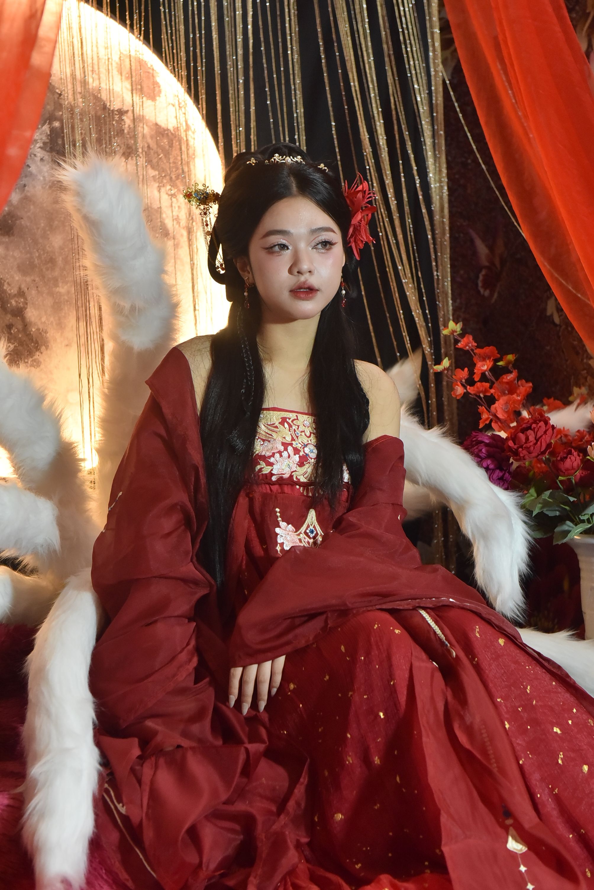 Elegant Woman in Traditional Red Dress with Floral Decor · Free Stock Photo