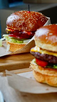 Mouthwatering cheeseburgers with fresh lettuce and tomato in Nigde, Turkiye.
