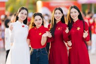 Group of Women Celebrating in Red and White Attire