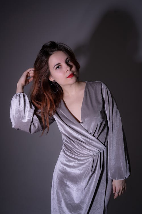 Free Woman Wearing Gray Long-sleeved Dress Stock Photo