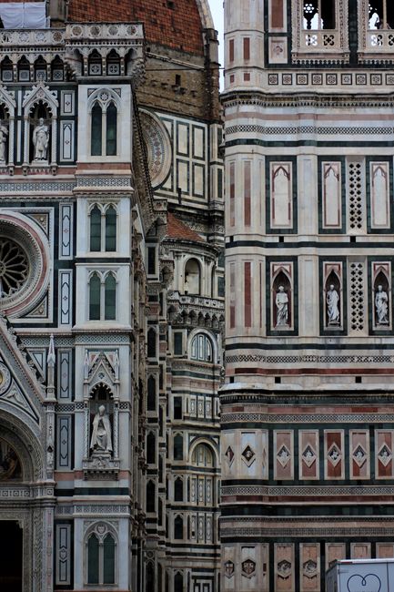 Close-up of the intricate facade of Florence Cathedral, showcasing Gothic architecture.