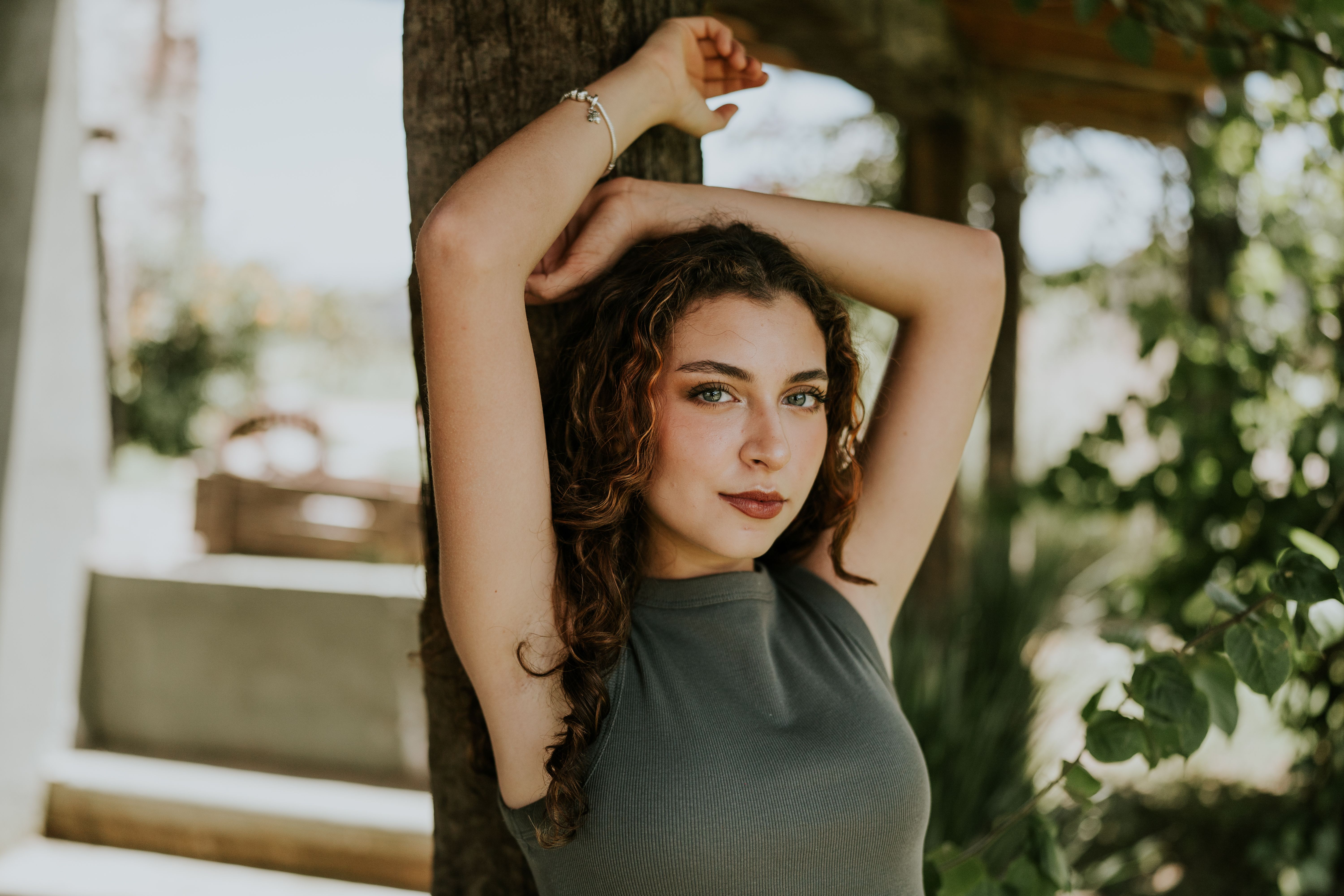 Elegant Woman Posing Outdoors in Natural Light · Free Stock Photo