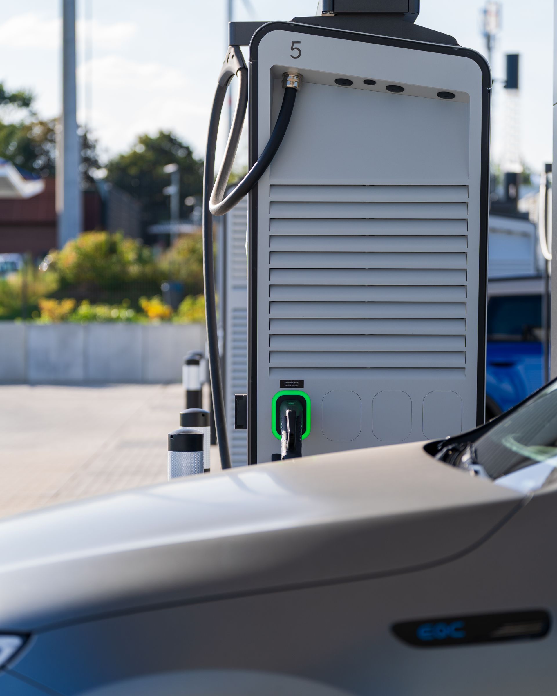 An EV charging at dusk.