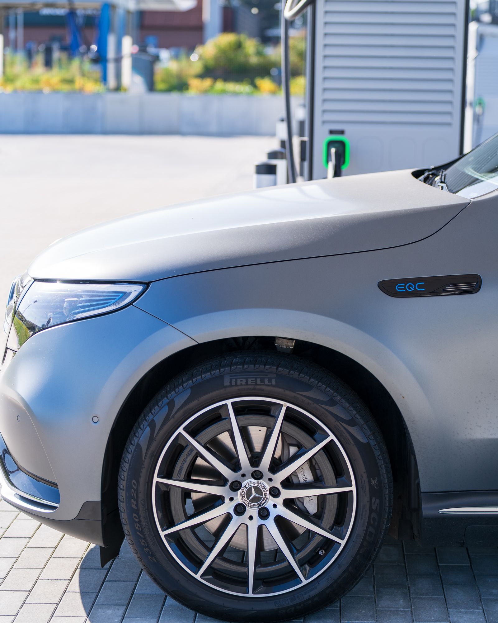 An electric car connected to a charging station
