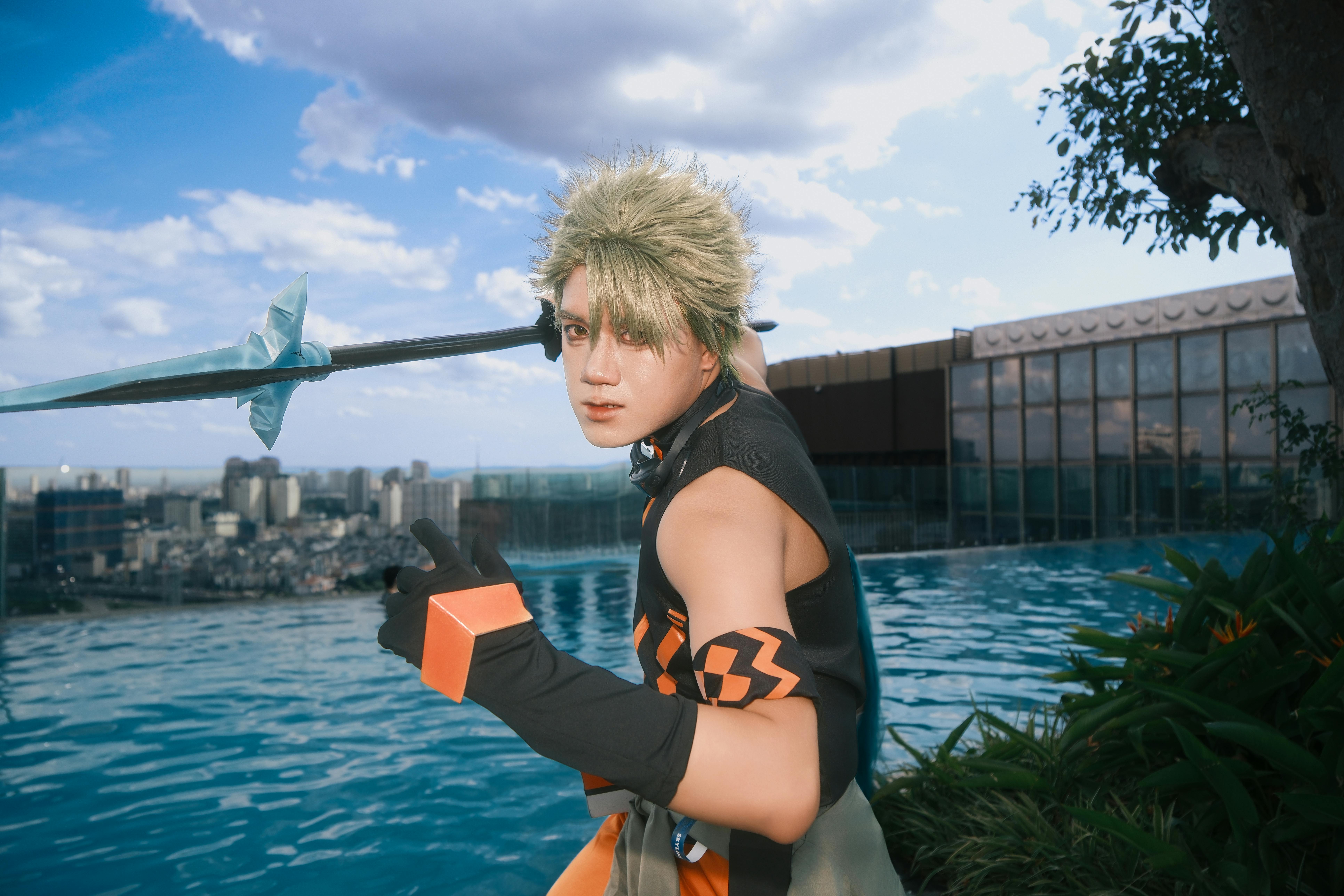 Dynamic cosplayer portrait by rooftop pool, holding spear, city skyline view.