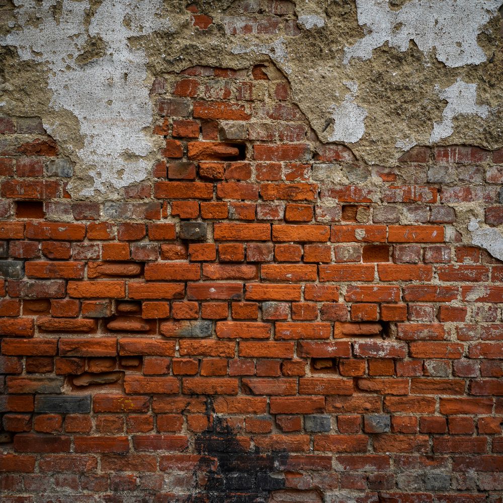 Wallpapering in Cheam — clean edges cut in around trim and sockets