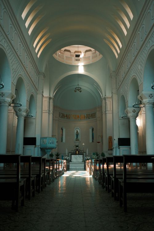 Free Sunlit church interior with high arches in Hà Nội, Vietnam, showcasing architectural beauty. Stock Photo