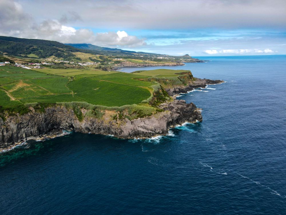 Aerial View of Scenic Coastal Cliffs and Ocean · Free Stock Photo