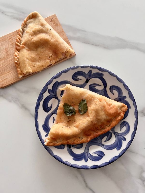 Spinach and wild mushroom calzone — photo by Anya Dunes on Pexels