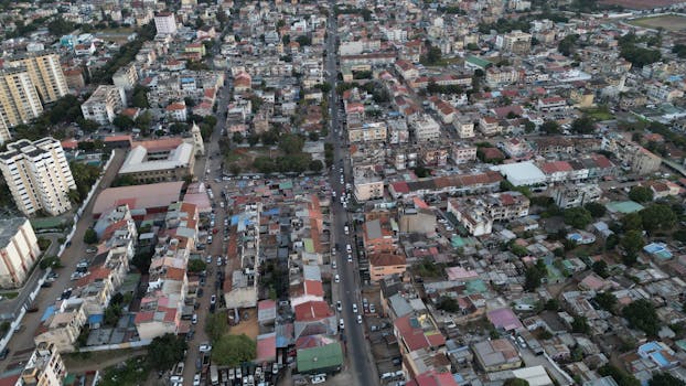 High-angle aerial view of urban landscape in Maputo, Mozambique, showcasing dense city buildings and streets.