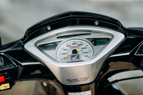 Free Detailed view of a motorcycle speedometer with visible electric starter indicator. Stock Photo