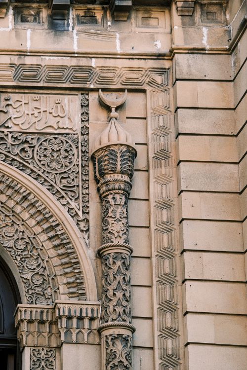 Free Detailed view of Islamic architectural carvings, showcasing intricate designs and cultural art. Stock Photo