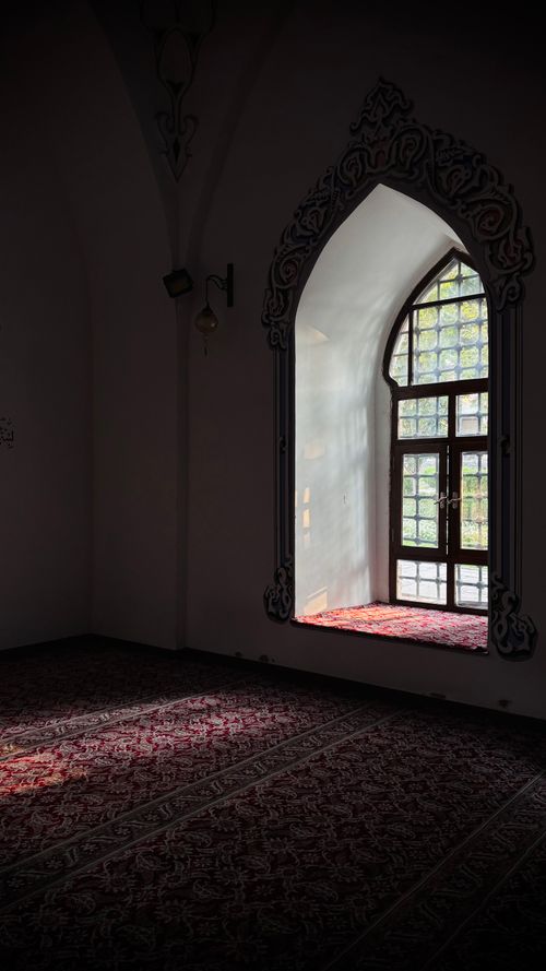 Free A peaceful room with intricate window casting light, capturing tranquility. Stock Photo
