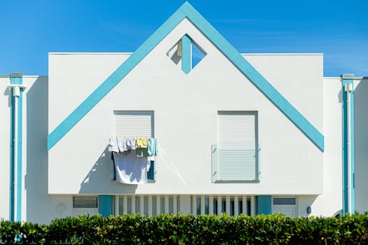 Contemporary building facade in sunny Aveiro, Portugal with clothesline.